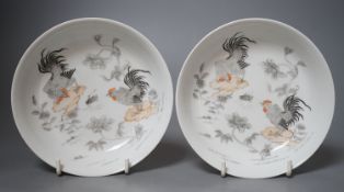 A pair of Chinese rouge de fer saucer dishes, 14 cm diameter