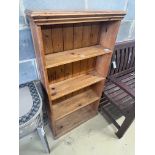 A pine open bookcase, width 66cm depth 21cm height 125cm