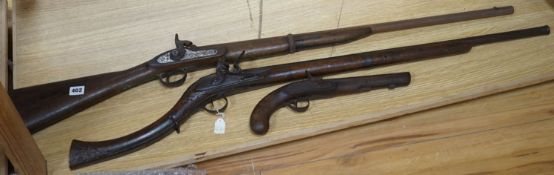 A Continental flintlock musket, a Victorian percussion musket stamped VR beneath a crown and Pimlico