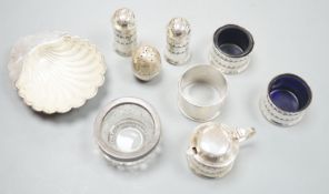 Five assorted silver condiments, napkin ring and silver shell dish with glass liner, etc