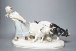 A Meissen figural group of young female rearing goats, modelled by Otto Piltz, 41cm long