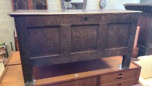 A 17th century and later carved oak coffer width 115cm, depth 43cm, height 62cm.