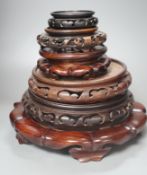 Six Chinese hardwood vase stands- largest 27 diameter.