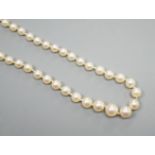 A single strand graduated cultured pearl necklace, with four stone diamond set white metal clasp,