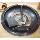A vintage roulette wheel, chips, push