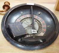 A vintage roulette wheel, chips, push