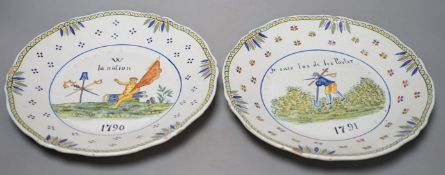 A pair of French faience plates - ‘la nation’, 1790, and ‘je suis las de les Porter’, 1791 - 24cm