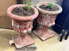A pair of painted reconstituted stone campana garden urns, diameter 36cm height 49cm