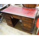 An early 20th century nine drawer writing desk, width 122cm depth 57cm height 75cm
