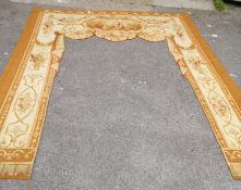 A French tapestry door surround woven with an octagonal vignette, floral swags and baskets of