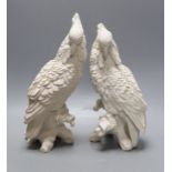A pair of white resin cockatiels - 28cm tall