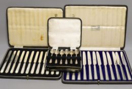 Two cased sets of silver or mother of pearl handled tea knives and a cased set of six silver