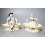 A pair of Meissen porcelain figural sweetmeat baskets, one incised number 3024, both initialled L.