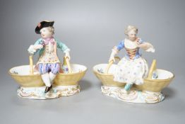 A pair of Meissen porcelain figural sweetmeat baskets, one incised number 3024, both initialled L.