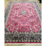 A fine North West Persian Kashan burgundy ground carpet, 336 x 242cm
