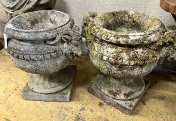 A pair of reconstituted stone circular rams head garden urns, width 50m height 46cm