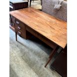 A mid century Danish style teak kneehole desk, width 105cm depth 59cm height 73cm