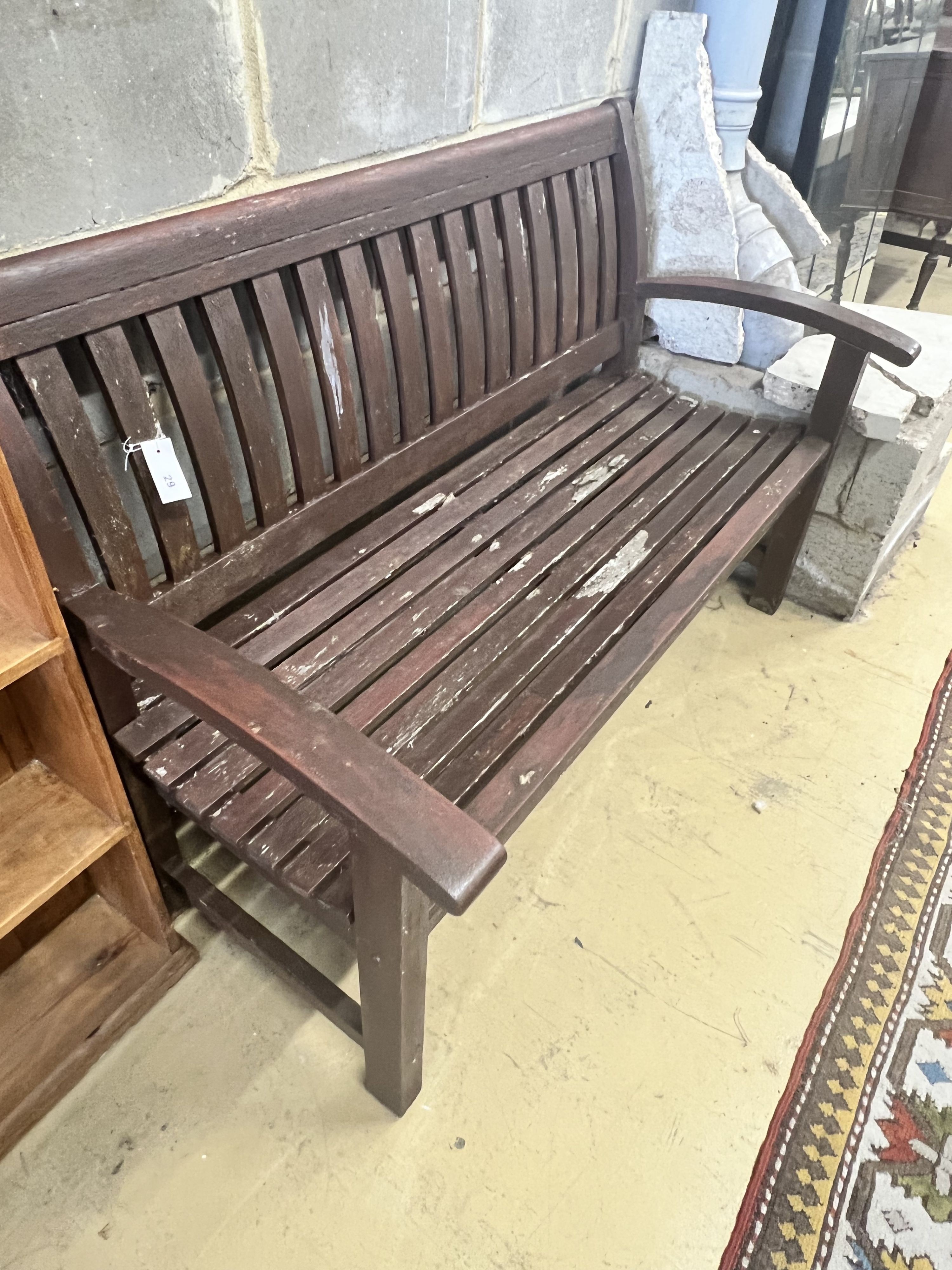 A stained teak slatted garden bench, 138 x 58cm height 92cm - Image 2 of 4