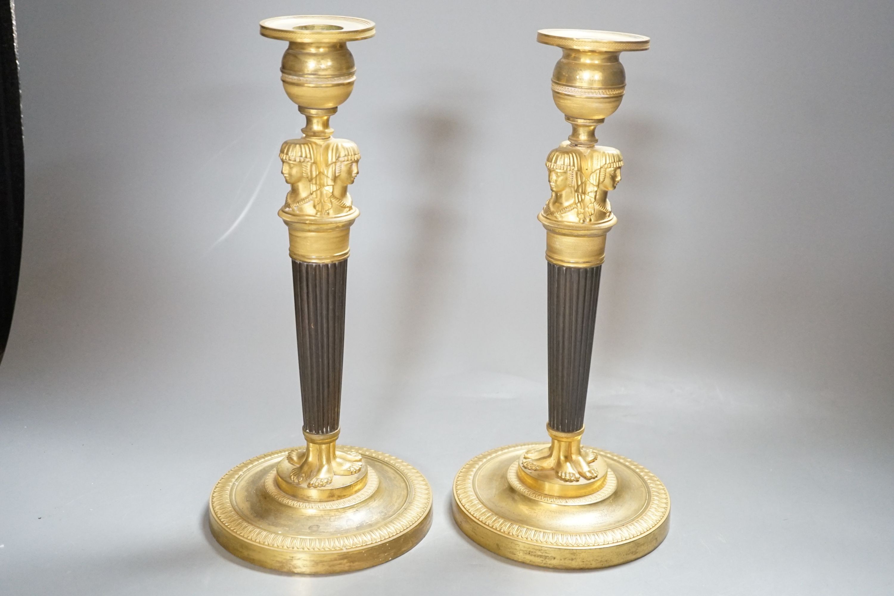 A pair of Empire style bronze and ormolu candlesticks - 29.5cm tall - Image 2 of 3