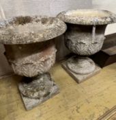 A pair of reconstituted stone acanthus moulded circular campana garden urns, diameter 49cm height
