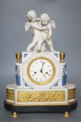 A 19th century French biscuit porcelain and ormolu mounted mantel clock, 43 cm high