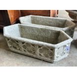 A pair of Gothic style reconstituted stone garden planters of elongated hexagonal form, width 88cm