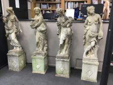 A set of four reconstituted stone garden figures, representing the Four Seasons, tallest 170cm