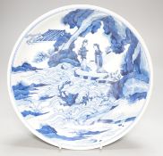 A Chinese blue and white dish, painted with figures, 27cm