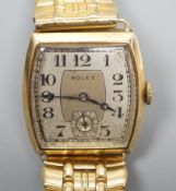 A gentleman's early 1930's 9ct gold Rolex manual wind wrist watch, with tonneau shaped case and