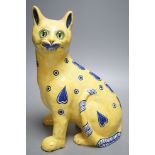A Mosanic Galle style seated yellow and blue faience cat - 31cm tall