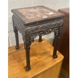 A Chinese marble topped carved hardwood jardiniere stand, width 35cm depth 35cm height 47cm