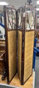 An Edwardian inlaid mahogany four fold part glazed dressing screen, each panel width 46cm height