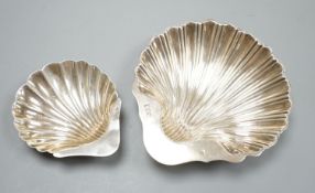 A scallop shell butter dish on three ball feet, Sheffield 1926, 94mm and an earlier larger silver