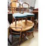 A Victorian burr walnut oval topped dining table, width 120cm, depth 85cm, height 70cm together with