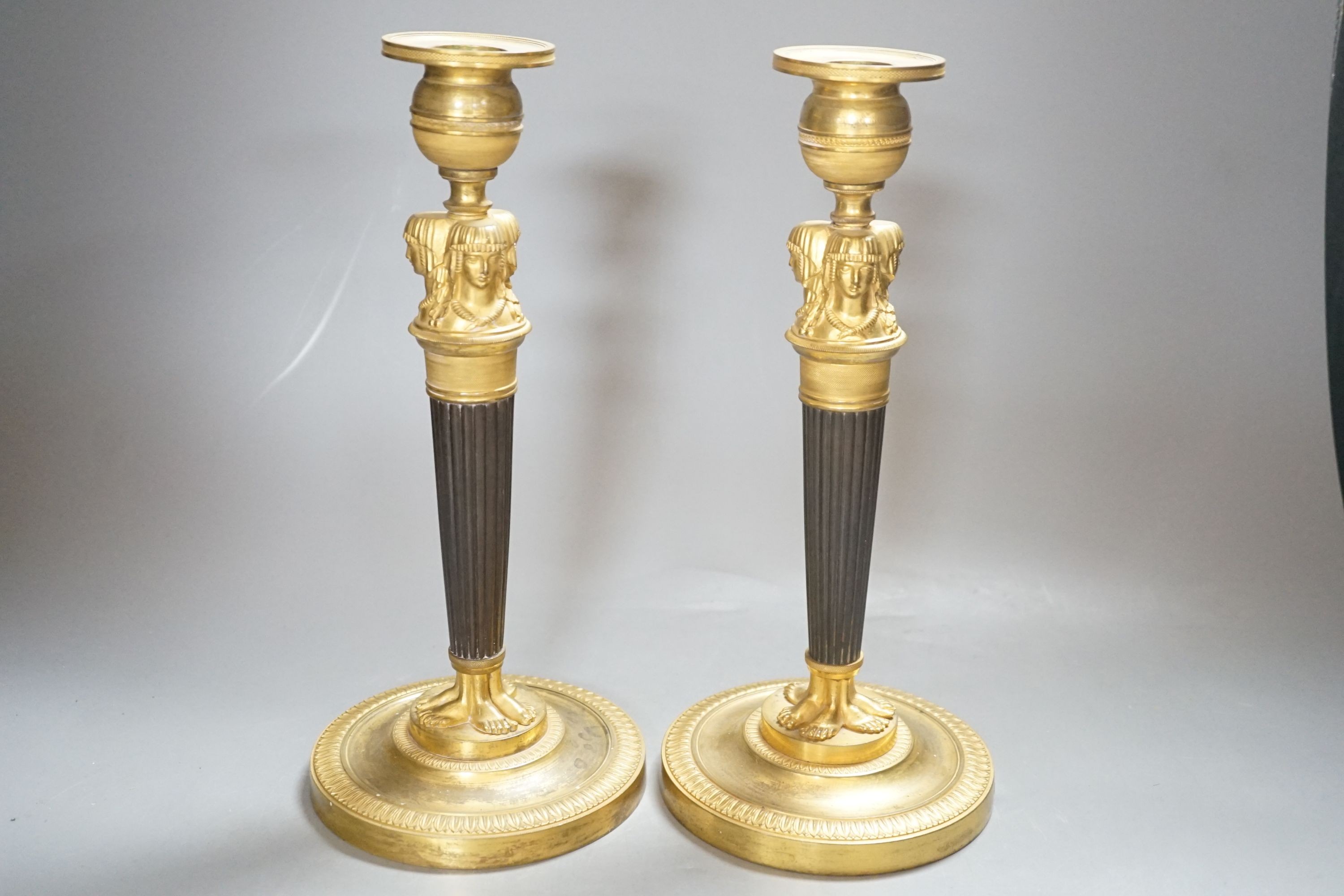 A pair of Empire style bronze and ormolu candlesticks - 29.5cm tall - Image 3 of 3