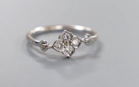 An Italian Cartier 750 white metal and four stone diamond cluster ring, size L, gross weight 2