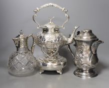 A silver plated tea kettle, burner and stand, ceramic insulators, 33 cm high a mounted claret jug