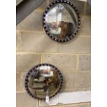 A pair of circular Irish style convex wall mirrors, diameter 43cm