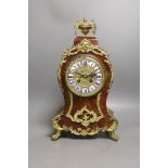 A late 19th century French scarlet tortoiseshell and ormolu mounted mantel clock - 40cm tall