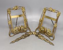 A pair of late 19th century brass photo frames, 20.5 cm high, and a pair of bronze furniture mounts