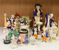 A large group of Staffordshire pottery figures and groups and figural cruets, to include a Nelson