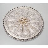 An Indian Goanese circular filigree work mirror, 23 cms diameter.