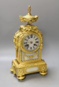 A 19th century French ormolu and alabaster mounted mantel clock with key and pendulum - 38cm high