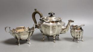 A late Victorian silver three piece bachelor's tea set, Birmingham 1900, gross 17oz.