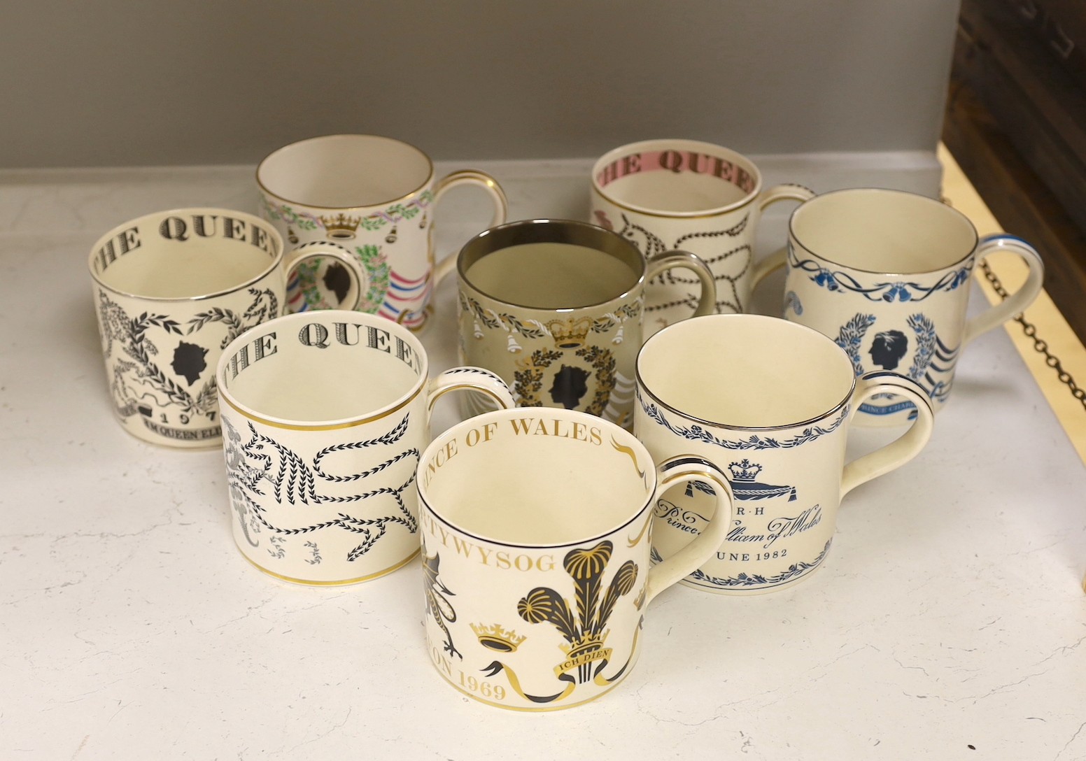 A collection of eight Wedgwood Richard Guyatt Royal commemorative mugs