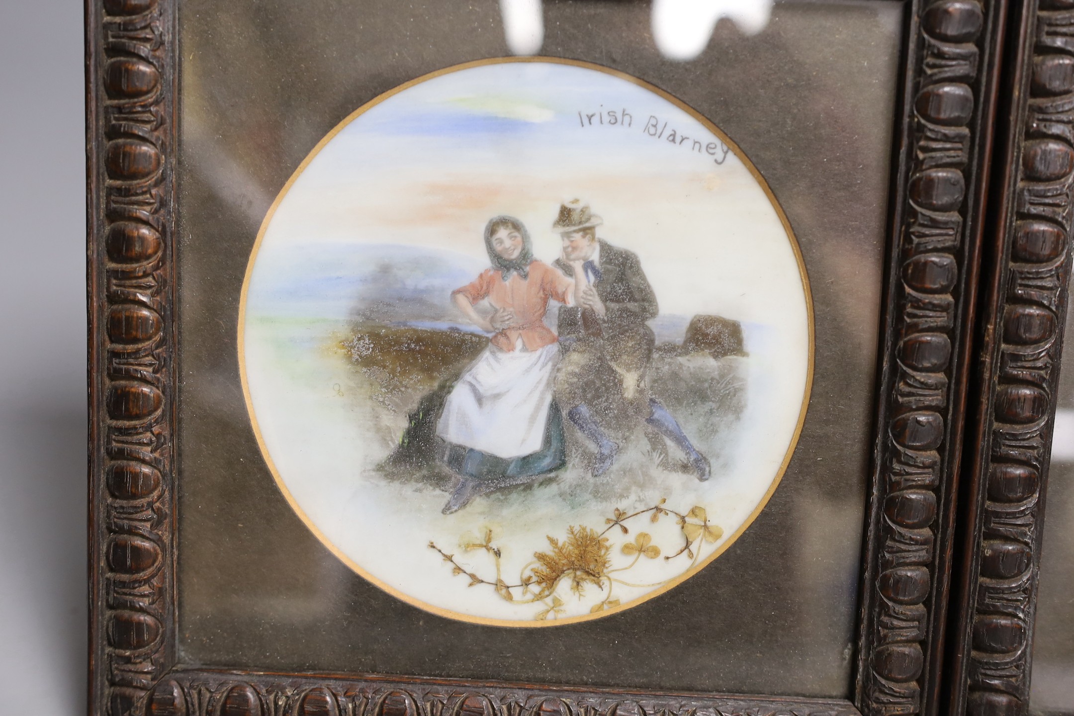 A pair of framed overpainted prints on glass, 13 cms diameter. - Image 2 of 3