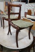 Six Regency mahogany cane and drop in seat dining chairs (four plus two) together with a pair of