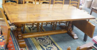 A good 18th century style Belvedere Furniture rectangular light oak refectory dining table, with end
