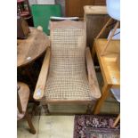 A caned hardwood plantation chair, width 66cm, depth 100cm, height 90cm