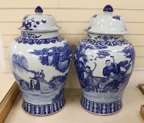 A pair of large Chinese blue and white jars and covers, 75 cms high.